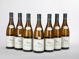 six bouteilles de vin blanc alignées