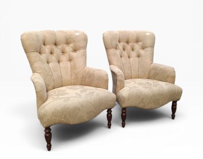 pair of upholstered armchairs with tufted upholstered arms