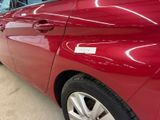 a red car that is parked in a garage