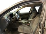 the interior of a car with the door open and the driver ' s seat down