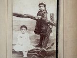 an old photo of a little girl and a boy
