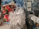 many items that are wrapped in plastic bags on the table