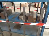 a metal rack with several pieces of metal on it