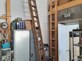 a ladder leaning up against a wall in a garage