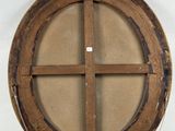 a picture of a round window on the wall