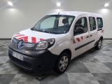the white van is parked on a checkered floor in the garage