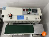an image of a machine that has a green board on it