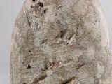 a stone vase that is sitting on a table