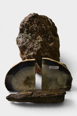 a piece of wood with a rock inside of it