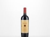 a bottle of red wine sitting on top of a table