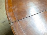 a wooden table with a glass on top of it
