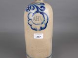 blue and white vase with a blue swirl design on the bottom