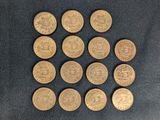 six different types of bitcoins laid out on a black surface