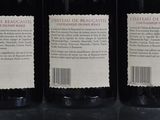 three bottles of wine that are sitting on a table