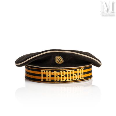 a black hat with a gold and black stripe on it