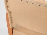 a wooden chair with a leather seat and back rest
