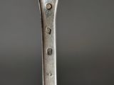 a close up of a fork with a face on it
