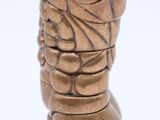 a bronze vase with a face on the top of it