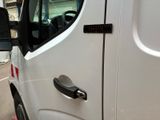 a close up of a white truck with a door handle