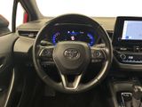 the interior of a car with a steering wheel, dashboard, and display screen