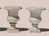 three vases sitting next to each other on a table