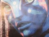 a close up of a person with a face painted in blue