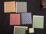 several different colored stamps are arranged on a black surface