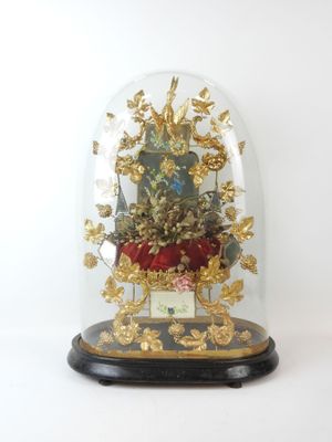 a glass dome with a clock inside of it