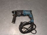 a cord that is connected to a drill on a table