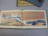 an open book with a picture of a plane and a book with a picture of a plane on it
