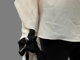 an image of a woman wearing a white shirt and black pants