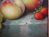 a painting of two peaches and a strawberry on a table