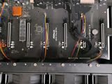 a black electronic device with multiple wires attached to it