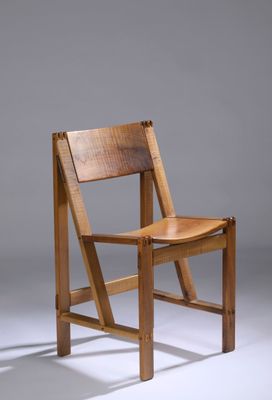 an image of a wooden chair sitting on top of a white floor