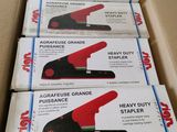 four boxes of heavy duty staplers are stacked on top of each other