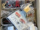 a box full of assorted toy cars and other items