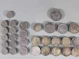 a lot of coins that are sitting on a table