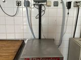 a scale on a table in a kitchen with a lot of counter space