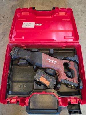 an image of a red tool box with tools in it