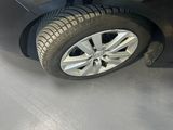 a picture of a car that is parked in a garage