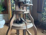 a wooden table with a wooden top and a metal base