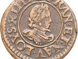 gros plan d'une pièce de monnaie sur une surface blanche