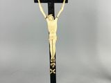 an image of a statue of jesus on a cross on a table