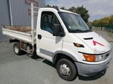 a white truck with a red arrow painted on the side of it