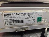 a label on the back of a machine that says adam