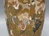 a vase that has a picture of a man and a woman on it