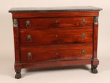 an antique chest of drawers with a marble top