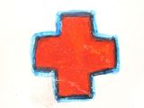 a red cross painted on a white wall