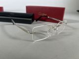 glasses are laying on a table next to a pair of glasses