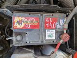 a close up of a car ' s engine with a sticker on it